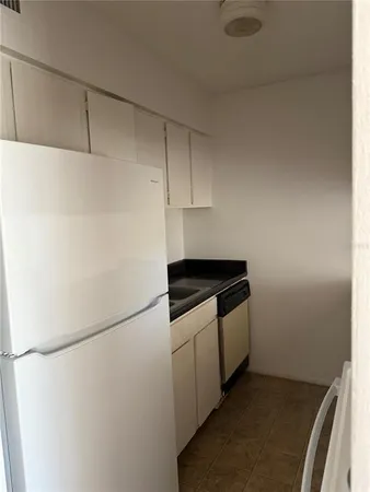 a kitchen with a stove and cabinets