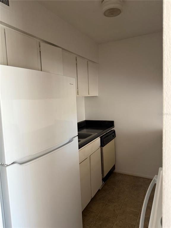 5317 Curry Ford Road, Unit 103 Orlando, FL 32812 - Photo 7 of 10 a stove top oven sitting inside of a kitchen