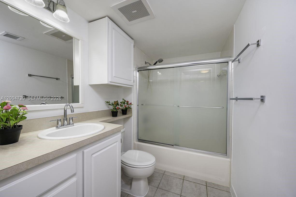 2665 Southwest 37th Avenue, Unit 201 Miami, FL 33133 - Photo 23 of 33 a bathroom with a sink toilet and shower