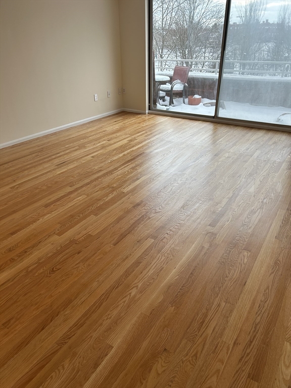 50 Main Street, Unit 409 Watertown, MA 02472 - Photo 3 of 9 a view of a room with wooden floor