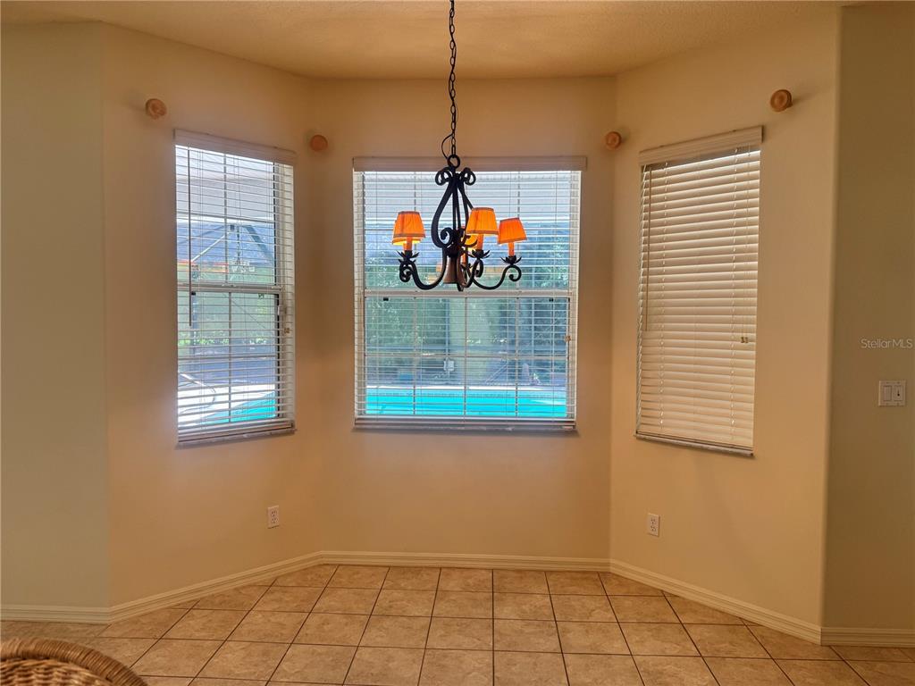 11145 Northwest 17th Court Road Ocala, FL 34475 - Photo 27 of 59 a room with window and ceiling fan