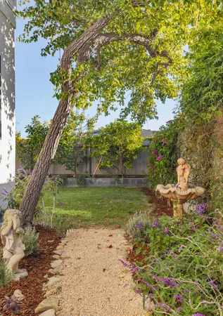a bedroom with furniture and a flat screen tv