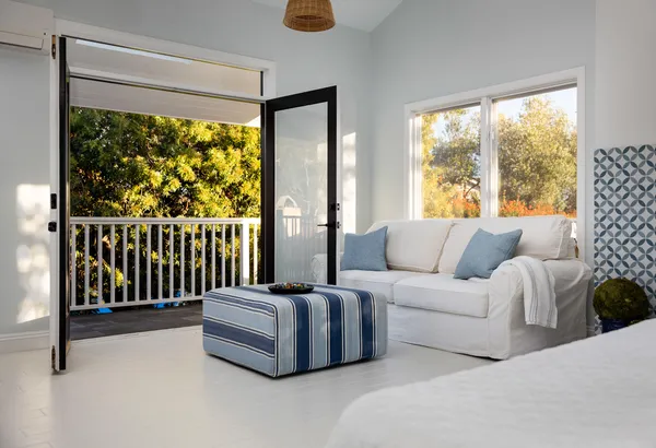 a view of balcony with wooden floor