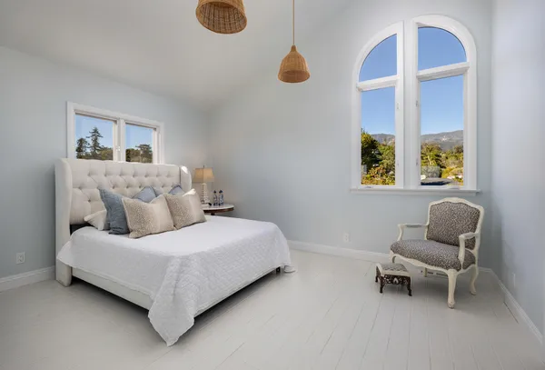 a room with furniture and a large window
