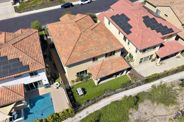 an aerial view of a house with a swimming pool