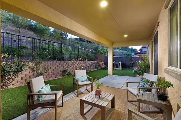 a view of yard with patio