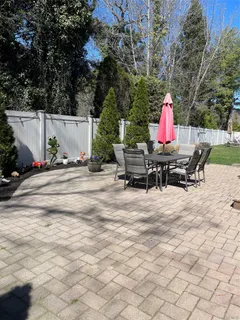 a view of backyard with sitting area