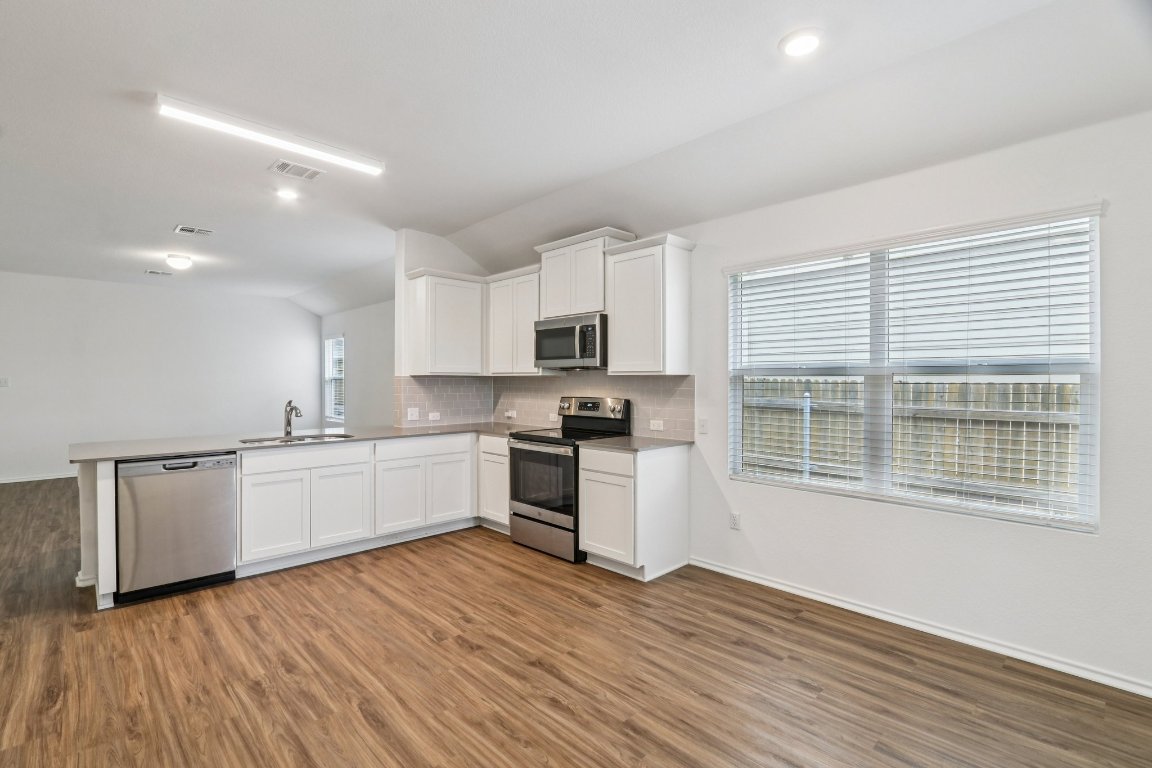 240 Line Of Fire Way Jarrell, TX 76537 - Photo 11 of 33 Kitchen and dining area