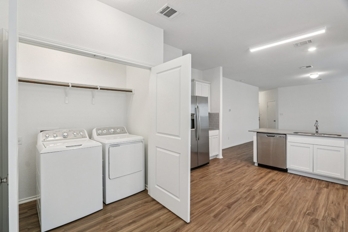 240 Line Of Fire Way Jarrell, TX 76537 - Photo 12 of 33 Laundry area in kitchen