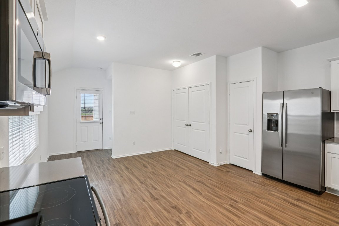 240 Line Of Fire Way Jarrell, TX 76537 - Photo 13 of 33 Kitchen, laundry and dining area