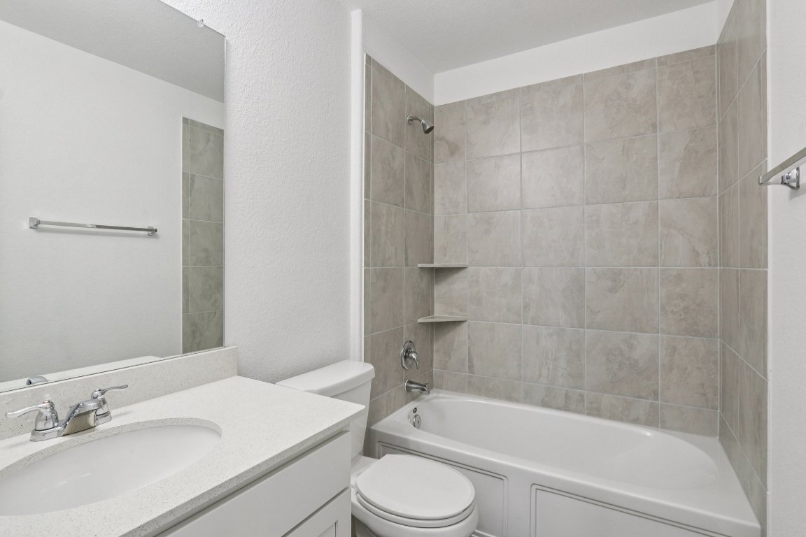 240 Line Of Fire Way Jarrell, TX 76537 - Photo 15 of 33 Bathroom featuring shower / bath combination, and vanity
