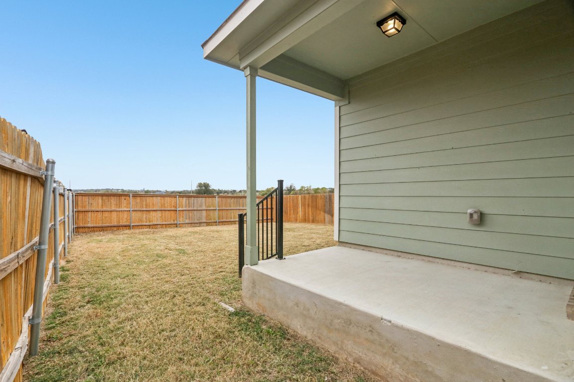 240 Line Of Fire Way Jarrell, TX 76537 - Photo 28 of 33 Fenced backyard featuring a patio, no neighbors behind