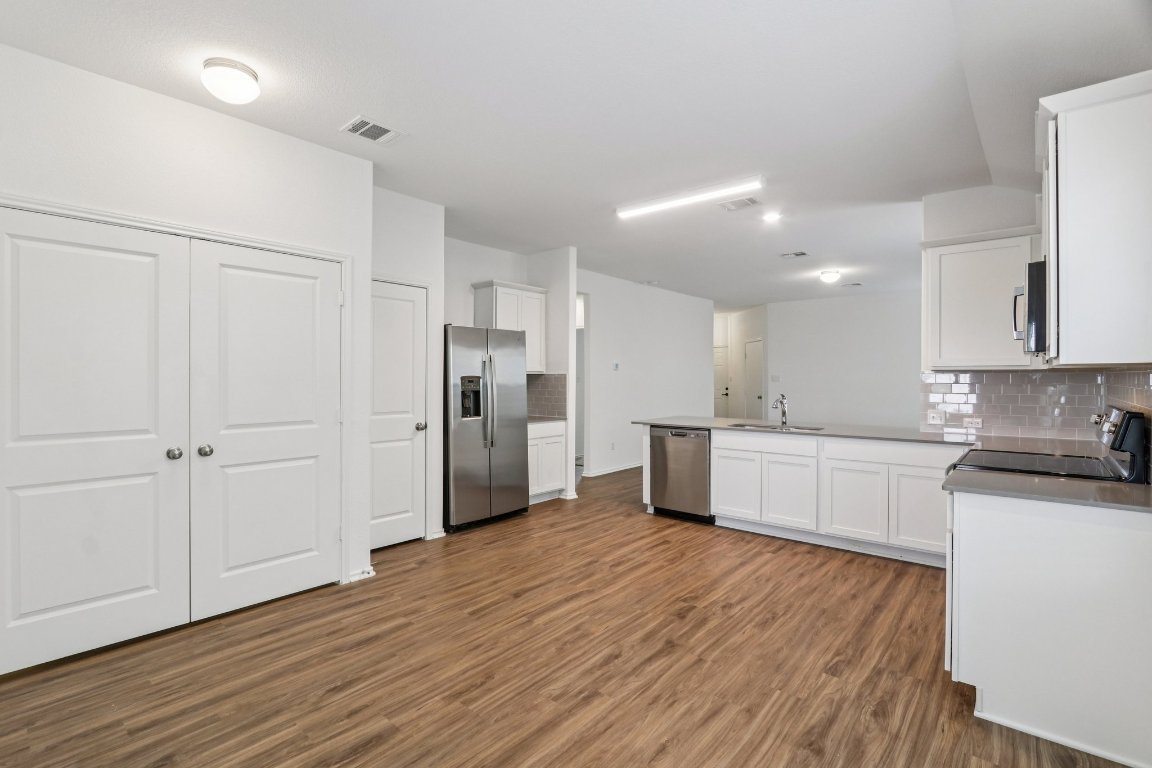 240 Line Of Fire Way Jarrell, TX 76537 - Photo 10 of 33 Kitchen and dining area