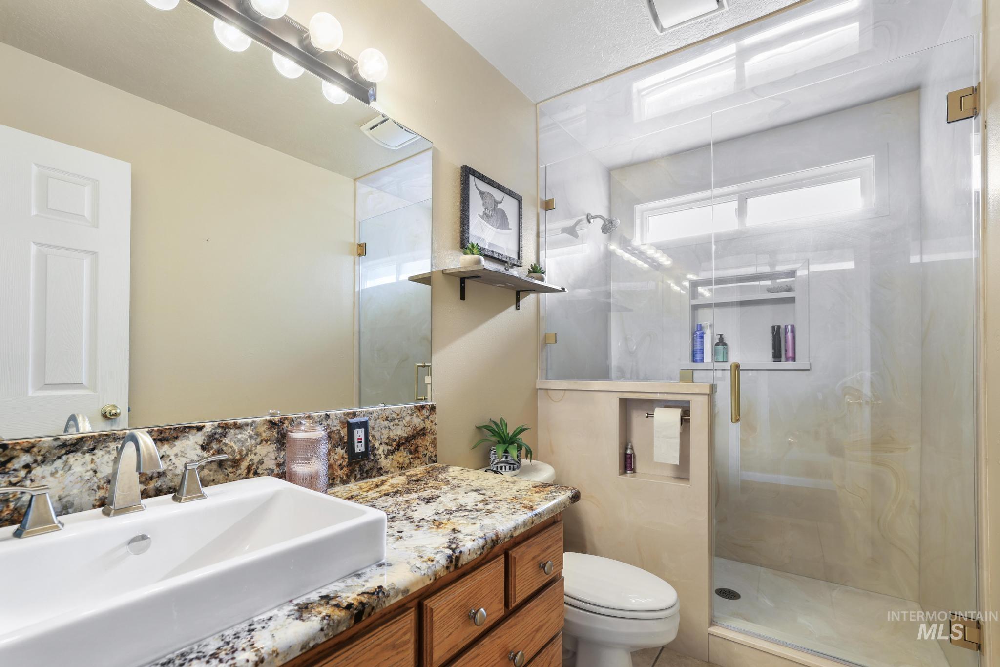 733 Beta Circle Twin Falls, ID 83301 - Photo 12 of 50 Full bath with vanity and a stall shower