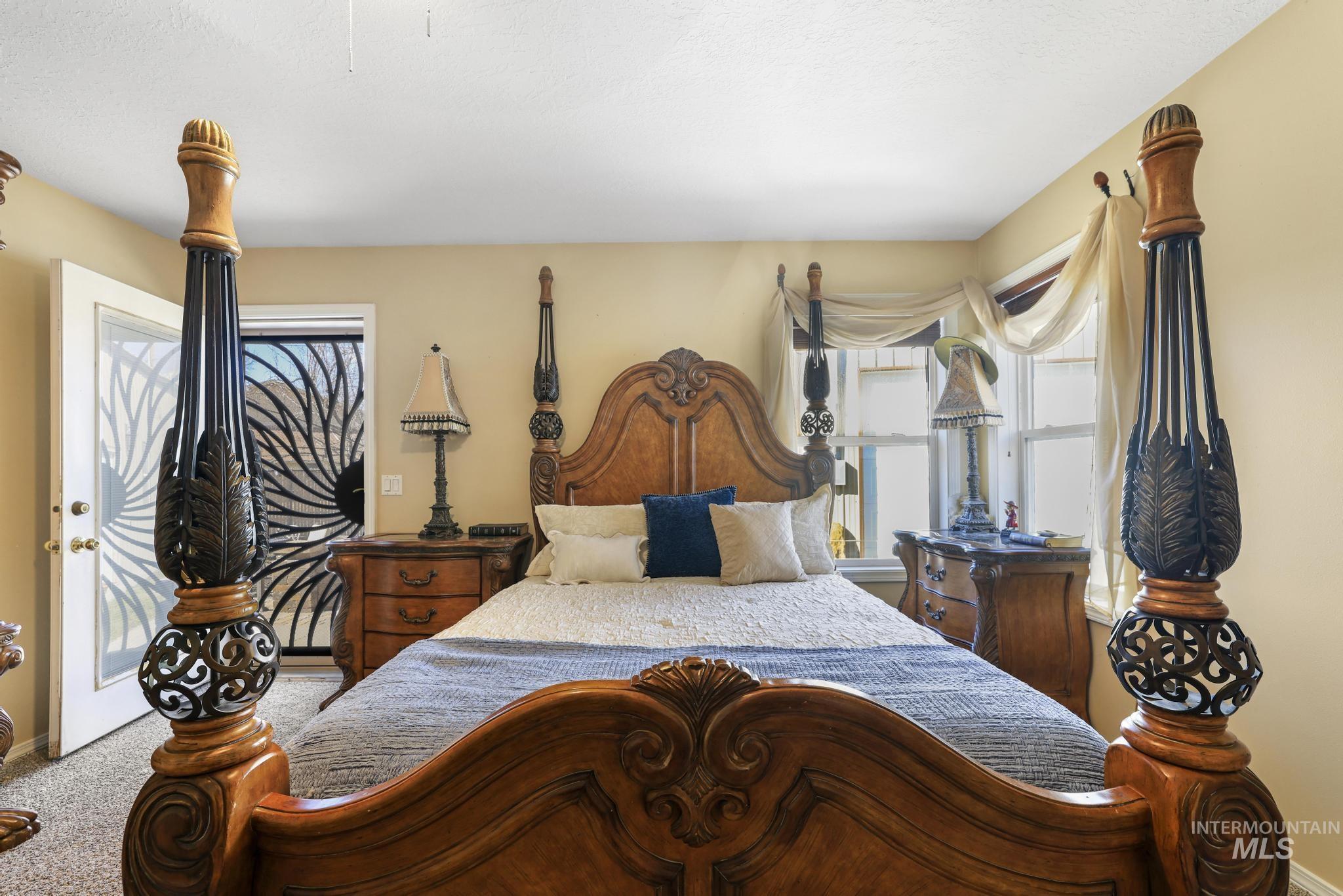 733 Beta Circle Twin Falls, ID 83301 - Photo 18 of 50 Bedroom with carpet and access to outside