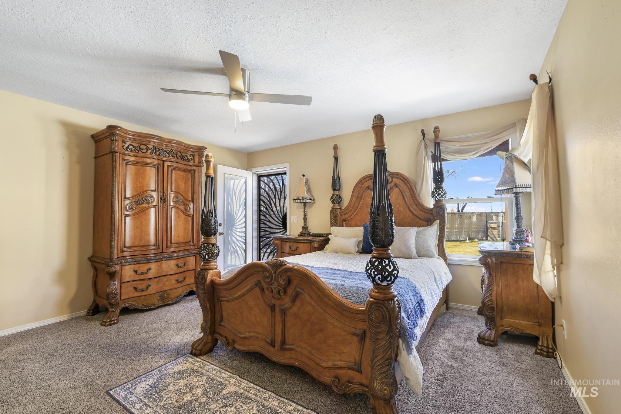 733 Beta Circle Twin Falls, ID 83301 - Photo 20 of 50 Bedroom featuring carpet flooring and a ceiling fan