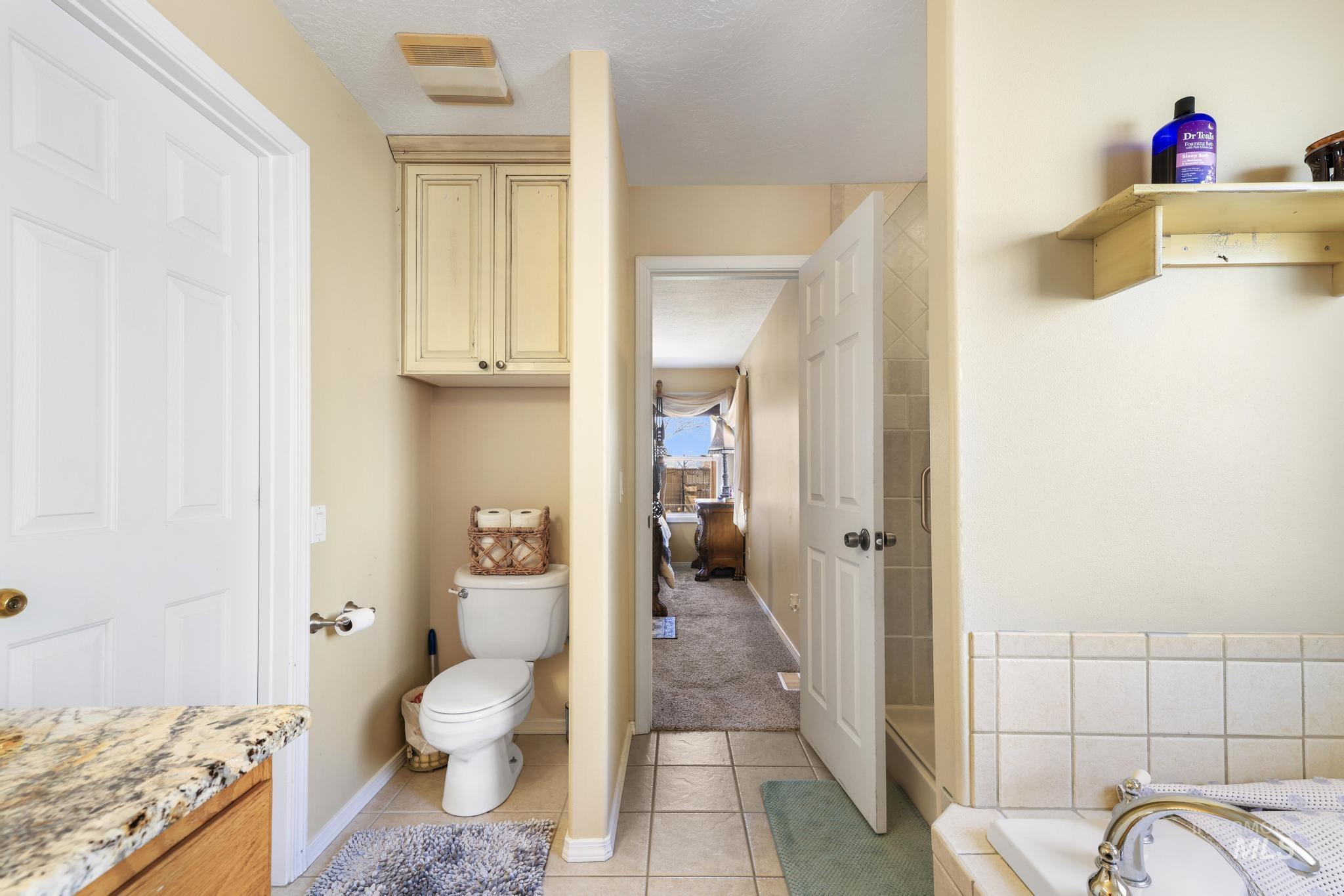 733 Beta Circle Twin Falls, ID 83301 - Photo 21 of 50 Full bathroom with light tile patterned floors, a bath, and vanity