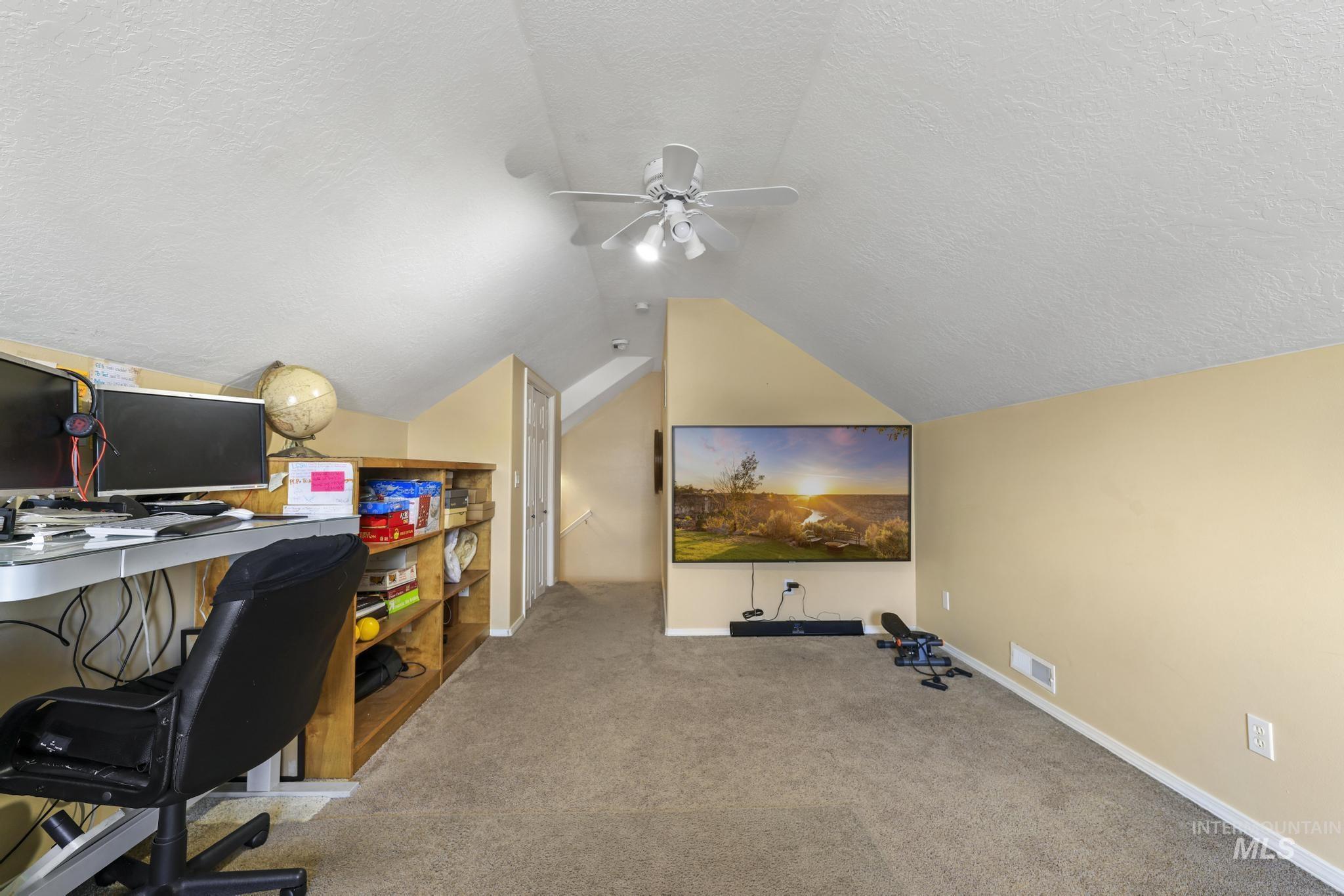 733 Beta Circle Twin Falls, ID 83301 - Photo 25 of 50 Office area featuring a textured ceiling, light colored carpet, and a ceiling fan