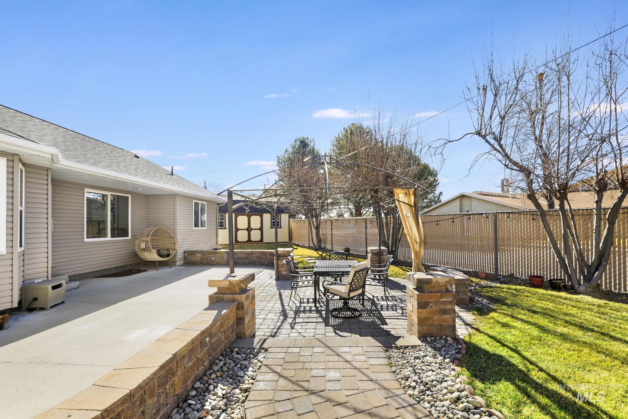 733 Beta Circle Twin Falls, ID 83301 - Photo 42 of 50 Fenced backyard featuring a patio and outdoor dining area