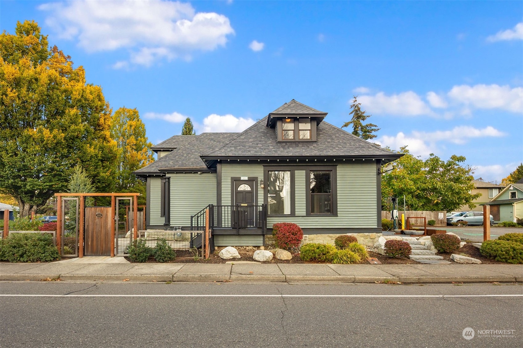 1012 Dupont Street Bellingham, WA 98225 - Photo 1 of 1 a front view of a house with a garden and entertaining space