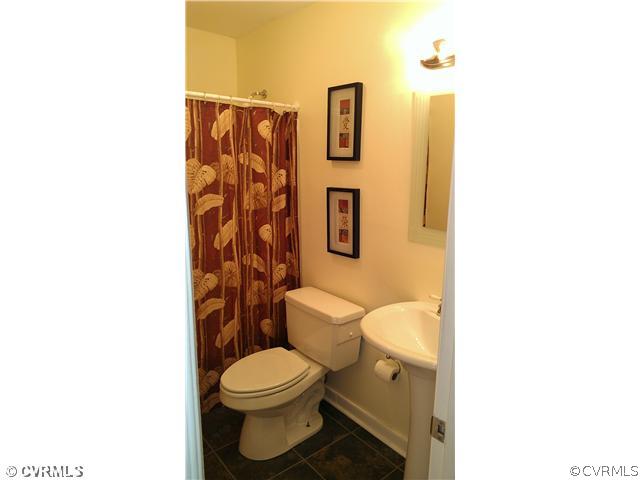 3114 Shiloh Church Road Midlothian, VA 23112 - Photo 17 of 24 a white toilet sitting next to a bathroom sink