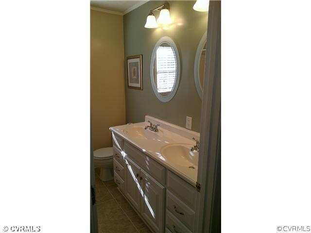 3114 Shiloh Church Road Midlothian, VA 23112 - Photo 19 of 24 a utility room with a sink and a mirror