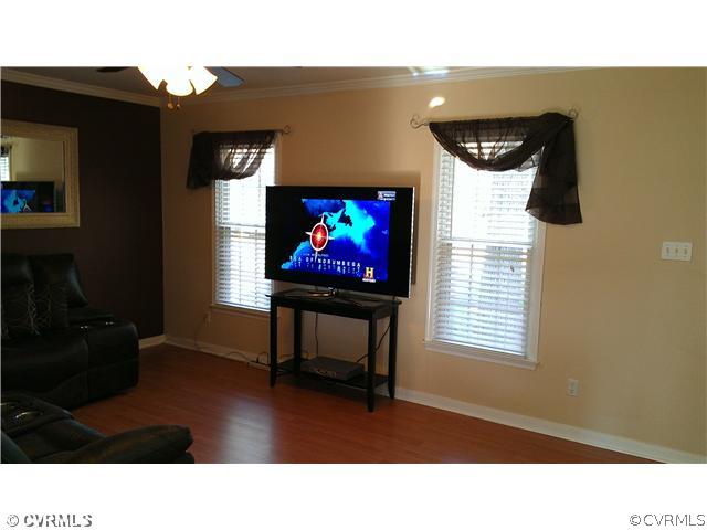3114 Shiloh Church Road Midlothian, VA 23112 - Photo 9 of 24 a living room with furniture and a flat screen tv
