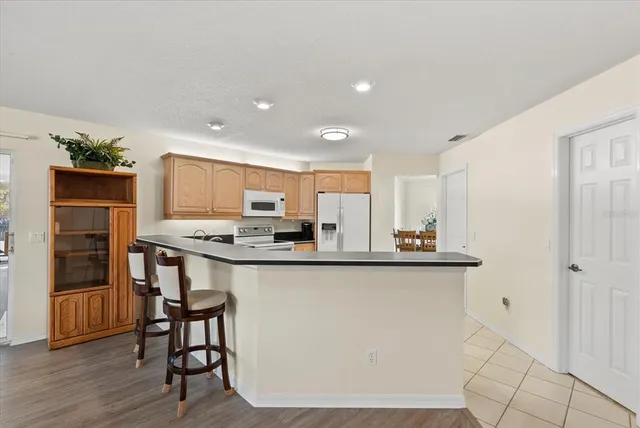 a bedroom with a large bed and a flat screen tv