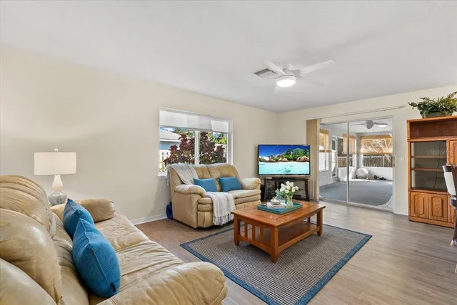 a bedroom with a large bed and a large window