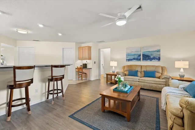 a bathroom with a granite countertop sink a mirror and a shower
