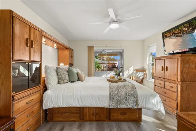 a bedroom with a bed and a lamp on table