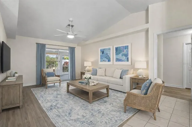 a bedroom with a large bed and a large window