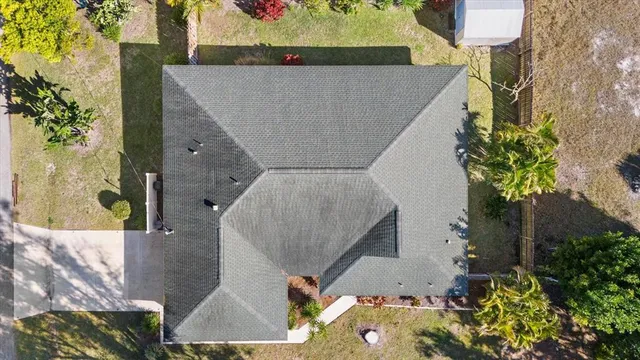 a view of a lake with houses in the back