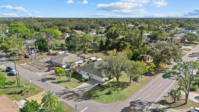 a view of an house with backyard space and sitting area