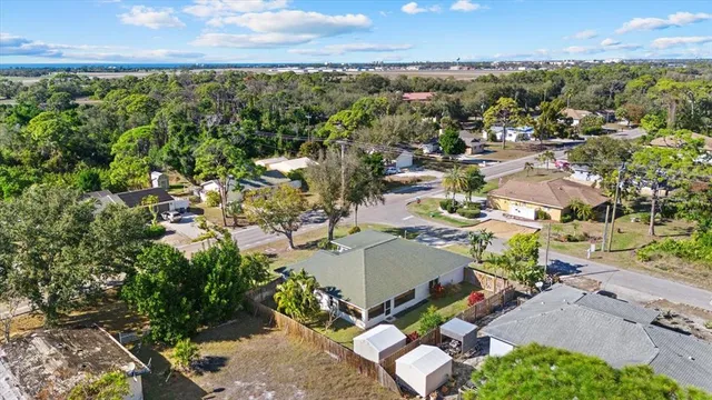 an aerial view of residential houses with outdoor space and street view
