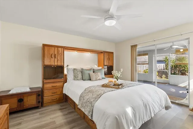 a kitchen with granite countertop white cabinets white stainless steel appliances with a sink and dishwasher