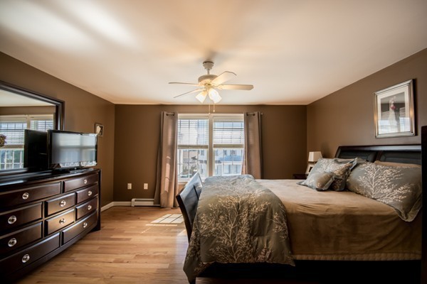 79 Huard Street Fall River, MA 02721 - Photo 11 of 30 a bedroom with a bed and a flat screen tv