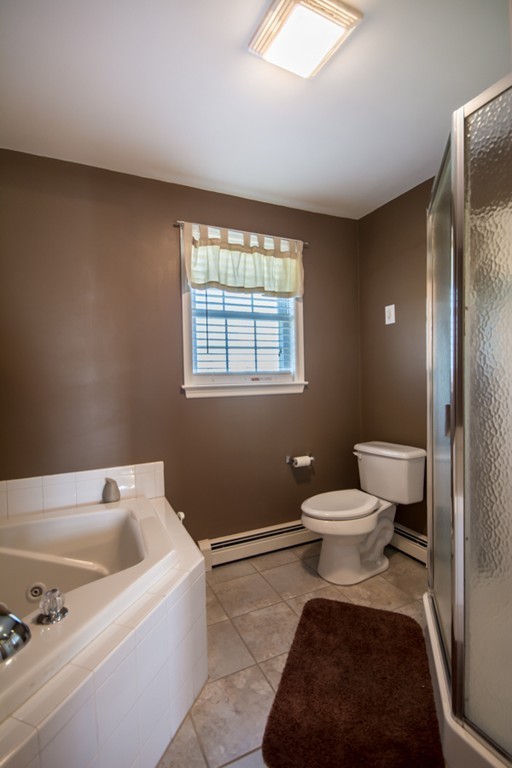 79 Huard Street Fall River, MA 02721 - Photo 15 of 30 a bathroom with a toilet and a bathtub