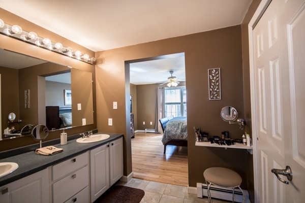 79 Huard Street Fall River, MA 02721 - Photo 16 of 30 a large bathroom with a double vanity sink and a mirror