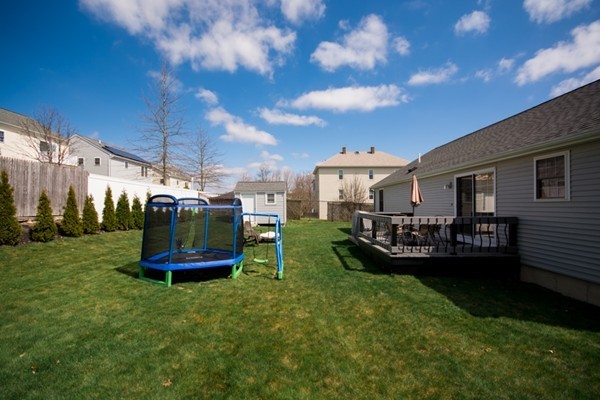 79 Huard Street Fall River, MA 02721 - Photo 28 of 30 a view of a chair and table in backyard of the house