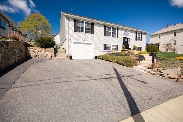 79 Huard Street Fall River, MA 02721 - Photo 30 of 30 a front view of a house with garden