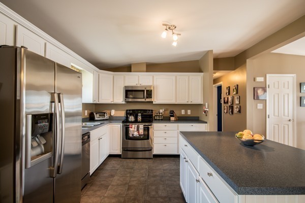 79 Huard Street Fall River, MA 02721 - Photo 8 of 30 a kitchen with stainless steel appliances granite countertop a refrigerator a stove and a sink