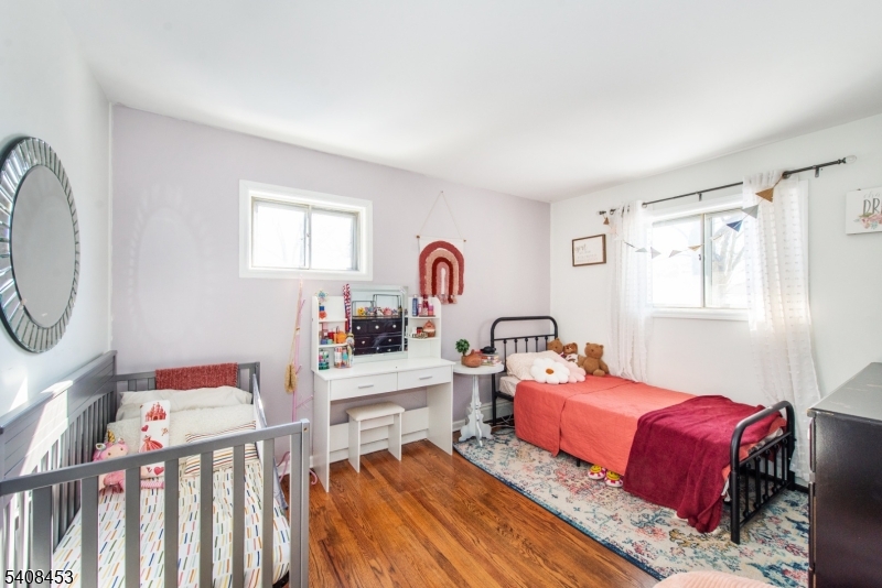 176 Harrison Road Parsippany, NJ 07054 - Photo 15 of 25 a bedroom with furniture and a window