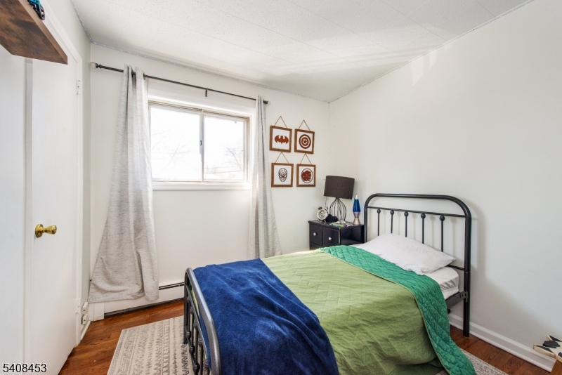 176 Harrison Road Parsippany, NJ 07054 - Photo 16 of 25 a bedroom with a bed and a window