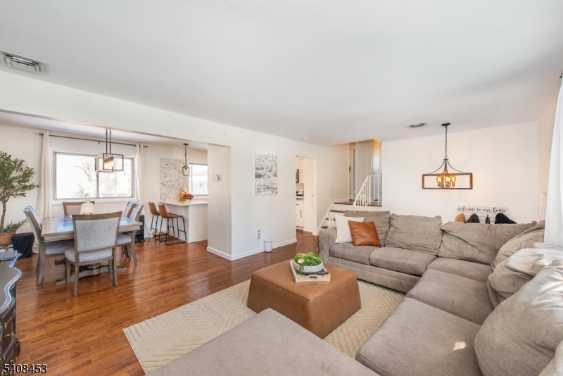 176 Harrison Road Parsippany, NJ 07054 - Photo 7 of 25 a living room with furniture and wooden floor