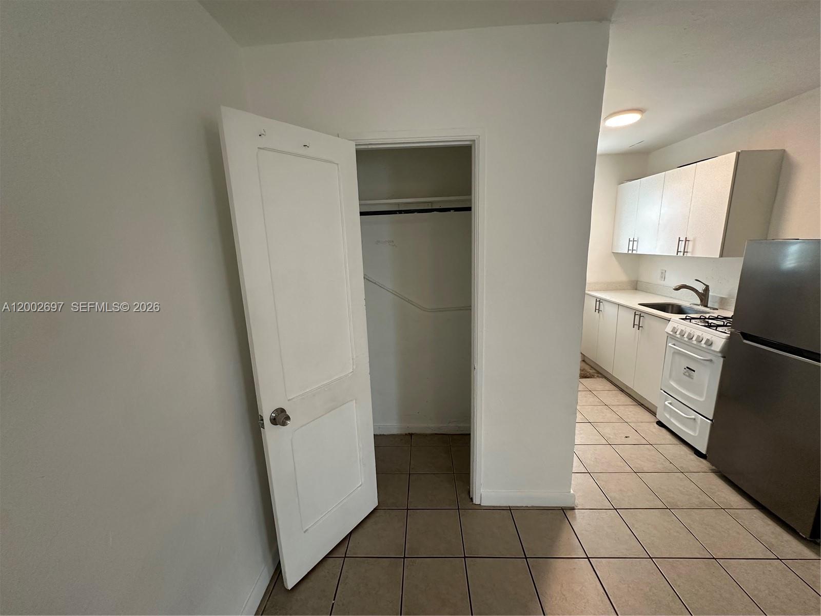 480 Southwest 10th Street, Unit 6 Miami, FL 33130 - Photo 7 of 7 a kitchen with a refrigerator and a stove