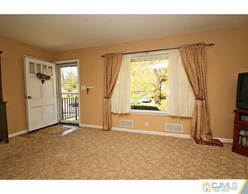 18 Dorian Road Metuchen, NJ 08840 - Photo 2 of 25 a view of an empty room with a window