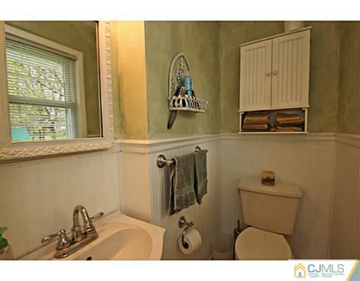18 Dorian Road Metuchen, NJ 08840 - Photo 17 of 25 a bathroom with a sink and a mirror