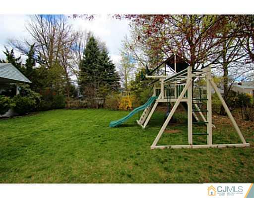 18 Dorian Road Metuchen, NJ 08840 - Photo 23 of 25 a view of a yard with swimming pool