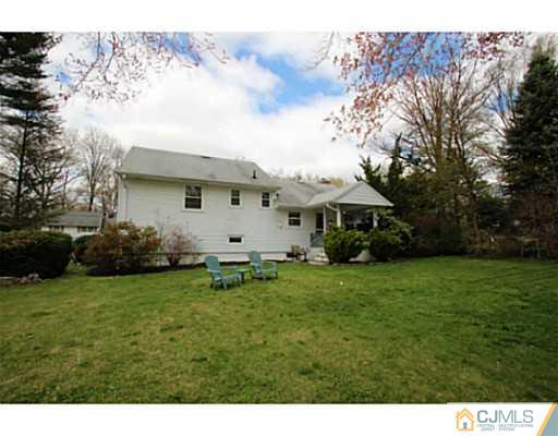 18 Dorian Road Metuchen, NJ 08840 - Photo 24 of 25 a view of a backyard with plants and large trees